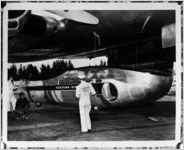 Loading cargo into an Eastern Airlines plane, 1958