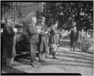 President Roosevelt and aides loading up in a car, 1930s