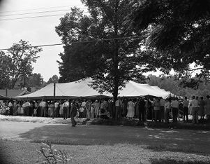 Crowds surrounding the Jessup Brothers Revival tent, 1950