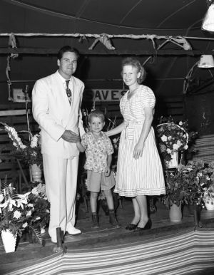 Reverend of the Jessup Brothers Revival tent service standing with two members, 1950