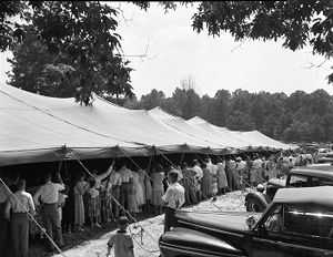 Crowds surrounding the Jessup Brothers Revival tent, 1950