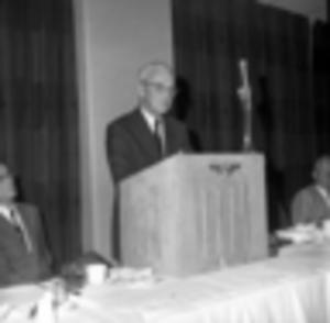Employee from Courts and Co. speaking during an event, 1969