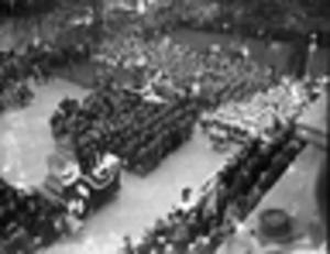 Overhead shot of participants, attendants, and band during a ceremony, 1950