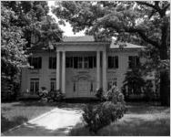 Exterior view of Margaret Mitchell's house at 1401 Peachtree Street, Atlanta, Georgia, May 22, 1952. Following Mitchell's death in August 1949, and because of a request she had made of her brother Stephens Mitchell, the house was razed in 1952. Before the house was destroyed, Dan Lane took these photographs at Stephens Mitchell's request. Copies of the prints were given to the Atlanta Historical Society (now, Atlanta History Center)