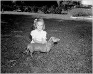Daughter of Lawrence Wood Robert, III, with her dog, Atlanta, Georgia, April 25, 1943