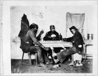 African American men playing cards (staged photograph)