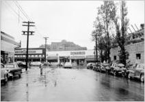 11th Street looking East towards Peachtree Street, Tremont apartment building in background,Atlanta, Georgia, September 6, 1950. Photos commissioned by famous defense attorney Reuben A. Garland, for his trail as lawyer for the plaintiff in "Meriweather v. Atlanta Transit Company," January 10, 1951, involving an accident at the corner of Peachtree and 11th