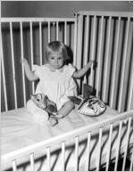 Baby Joyce Schultz in crib at Scottish Rite Hospital, August 21, 1951. Lane Brothers Commercial Photographers photo taken by W.C. Lane, Jr. for the child's father, Joe Schultz
