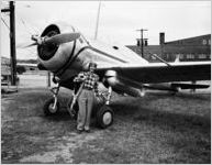 Female pilot with plane