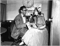 Anita Colby (right) being interviewed by a man from WCON radio station, Atlanta, Georgia, May 11, 1948