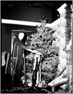 One-legged man with Christmas tree