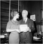 Richard H.  Rich receiving Go-Getter award from Linda Faye Carson