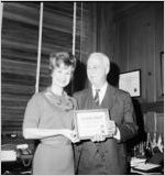 Richard H.  Rich receiving Go-Getter award from Linda Faye Carson