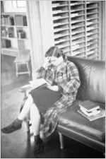 Agnes Scott College student reading near current periodicals area of College library, Decatur, Georgia, March 1, 1937