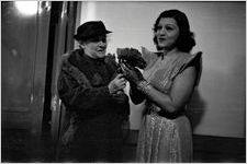 Woman giving bouquet of flowers to Rosa Ponselle, Fox Theatre, Atlanta, Georgia, October 14, 1937