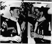 Coca-Cola-sponsored Boy Scouts event, one in a series of 17 copies of photographs. The Coca-Cola Company commissioned the copies in 1955. In this photo, two Boy Scouts are seen holding bottles of Coca-Cola