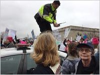 Police officer standing on car, Women's March on Washington, 2017-01-21