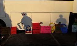 Signs against a bus, Women's March on Washington, 2017-01-21