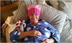 Liza Strub in bed wearing a pussy hat, Women's March on Washington, 2017-01-21