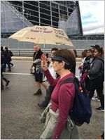 Protester carrying umbrella that reads Help Don't Hurt and Black Lives Matter, Atlanta March for Social Justice and Women, 2017-01-21