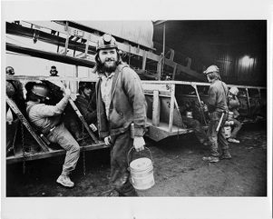 Bituminous coal miners board steel-topped man trip cars near Marissa, Illinois, 1976-06