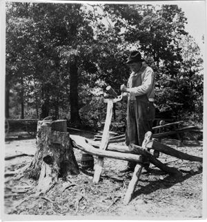 Coal miner chopping wood in Coal Creek, Tennessee, circa 1930s