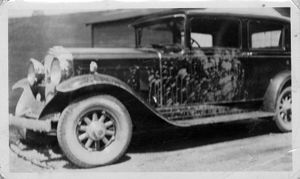 Van Bittner's vandalized automobile, circa 1920s