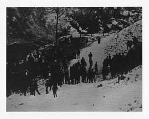 Coal miner meeting on snow-covered hill, circa 1910s