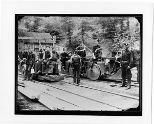 Coal miners with coal cars, circa 1900s