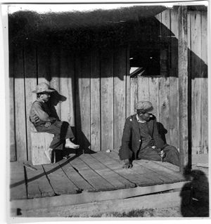Coal miner and son at home in Coal Creek, Tennessee, circa 1930s