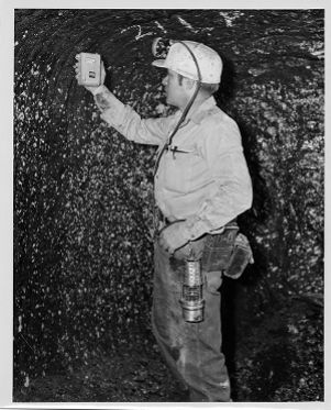 Foreman checks methane level with methanometer, circa 1960s