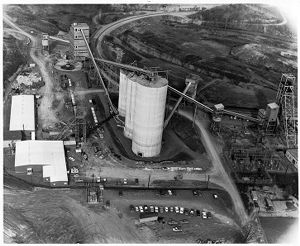 Aerial view showing rail cars, preparation plant, production shaft, coal silos, and office, circa 1950s