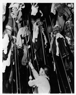 Coal miner in process of changing into work clothes in mine change room in Jewell Ridge, Virginia, circa 1960s