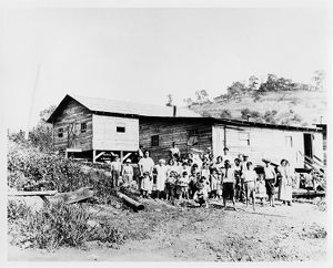 Coal miners' families outside of barrack homes in West Virginia, circa 1920s