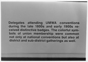Coal mining exhibit panel, early UMWA badges section, 1982