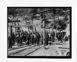 Group photograph of coal miners at mine entrance, circa 1910s