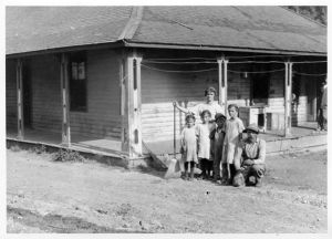 Coal miner and family in Rocky Mountain Fuel Company's Marcon Mine in Pitkin County, Colorado, circa 1910s