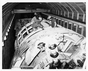 Tunnel boring machine cutter head being assembled in underground stall area at Eastern Associated Coal Corporation Federal No. 2 Mine, circa 1970s