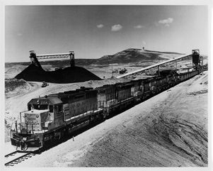 Mine tipple seen behind a Union Pacific train, circa 1970s