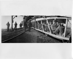 Young coal miners in man trip about to start a shift in mine, 1972-08