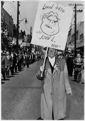 Member of United Mine Workers of America Local 4426 marching in a miners' parade, 1955-04-01