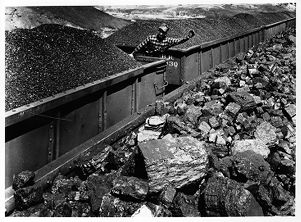 Trains hauling loaded coal cars, or hoppers, on their way to coal-consuming markets, circa 1960s