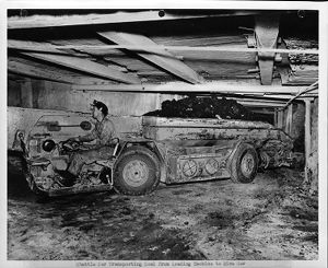 Shuttle car transporting coal from loading machine to mine car in Mine No. 32, of the Pittsburgh Consolidation Coal Company, 1951-05-03
