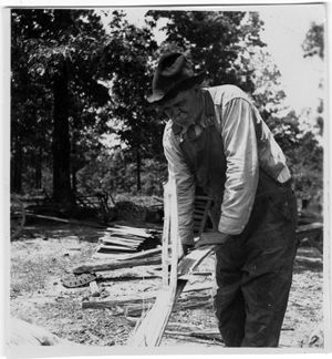 Coal miner chopping wood in Coal Creek, Tennessee, circa 1930s