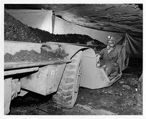 Woman miner operating coal shuttle car in Bethlehem Steel Corporation mine in Kentucky, circa 1970s