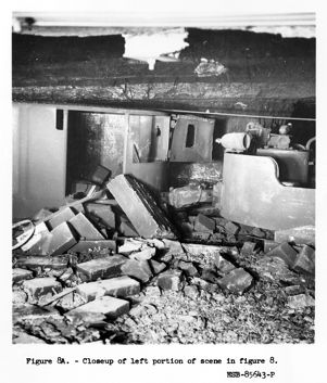 Closeup of motor and car blown off track by force of explosion, 1957-09-23