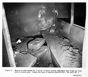Mantrip in chute between No. 7 and No. 8 entires showing compartment where Wright was found alive by rescue party, 1957-09-23