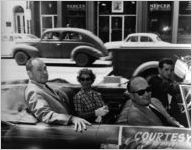 Ginger and Johnny Mercer in a convertible