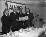Allright Auto Parks executives with stock certificates, 1964