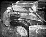 Police investigate the pickup truck where the body of Jeanette Reyman was found, 1947